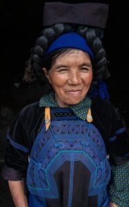 Smiling woman in traditional dress- vietnam 