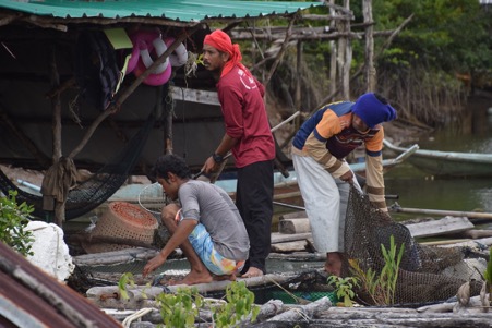 Local fishermen getting ready to take tourists out on an excursion as part of CBT in Khao Lak, Thailand.
