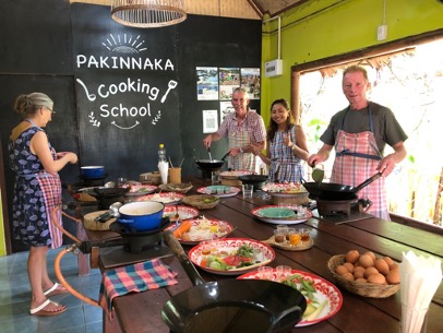 Wandee, founder and owner of Pakinnaka Cooking School in Khao Lak, Thailand teaching us how to cook authentic Thai food.