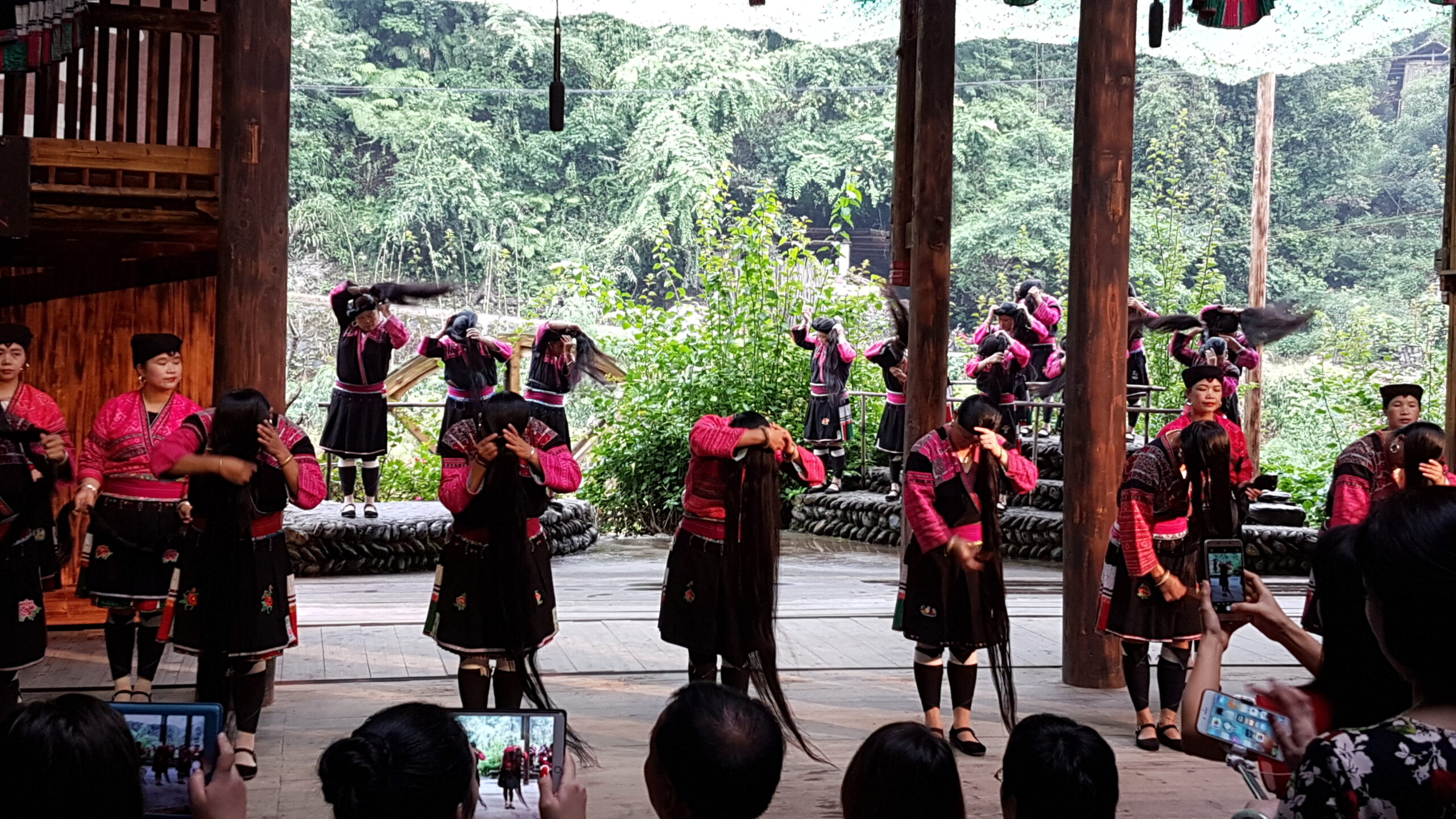 Yao women showing their long hair during a performance at Longji. Yao women showing their long hair during a performance at Longji.